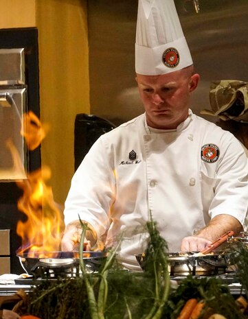 U.S. Marine Corps Gunnery Sgt. Michael D. Watts, mess chief, with 2nd Battalion 2nd Marine Division, competes in a cooking competition during Marine Week in Charlotte, N.C., Sept. 7, 2018. Marines, local chefs and students from Johnson and Wales University participate in a culinary competition using items from MREs during Marine Week Charlotte. Marine Week Charlotte is an opportunity for the people of the greater Charlotte area to meet Marines and learn about the Marine Corps’ history, traditions and value to the nation.