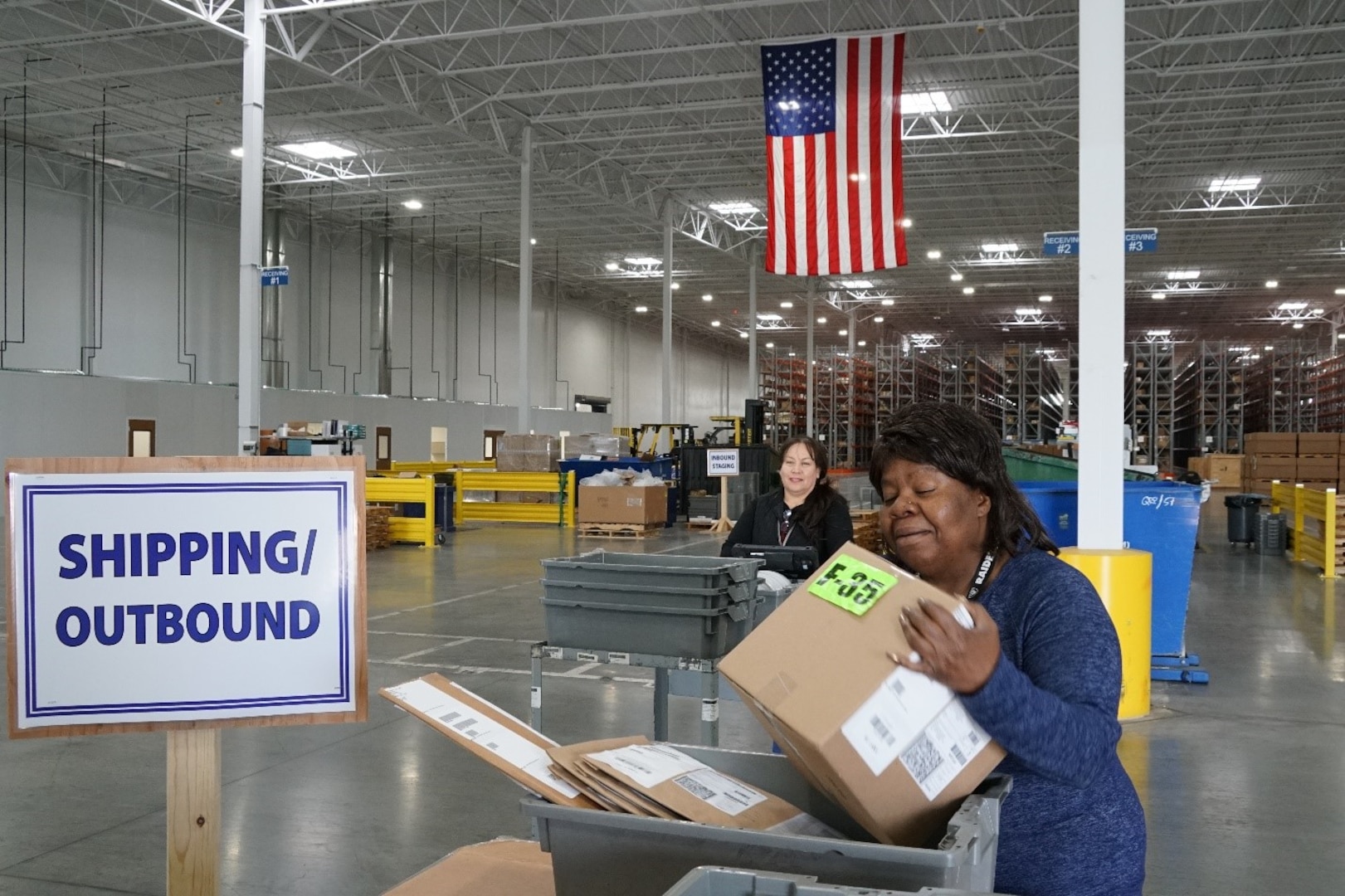 DDJC employees Charrisse Johnson and Margarita Pelayo process F-35 material.