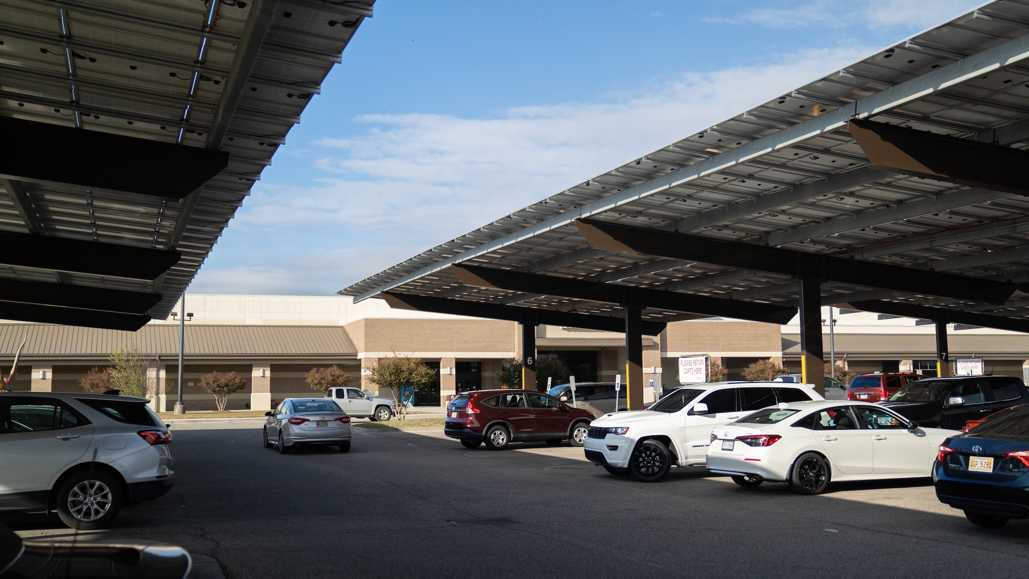 Cars park under the solar panel array at the Commissary and Base Exchange on Keesler Air Force Base, Mississippi, Oct. 25, 2022.