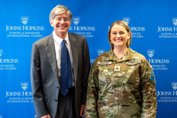 Jim Steinberg, dean of the Johns Hopkins University School of Advanced International Studies, stands with U.S. Space Force Col. Niki Lindhorst, Space Delta 13 commander, during her visit to the school in Washington, D.C., Oct. 26, 2022.