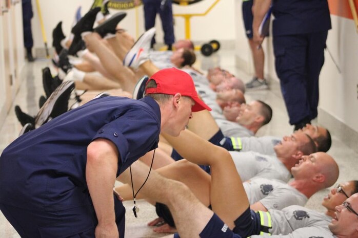 Officer Candidate Michael Barth and other recruits engage in physical fitness training to correct deficiencies during Reserve Officer Candidate Indoctrination at the Coast Guard Academy in June 2022. (Coast Guard Photo, Leadership Development Center)