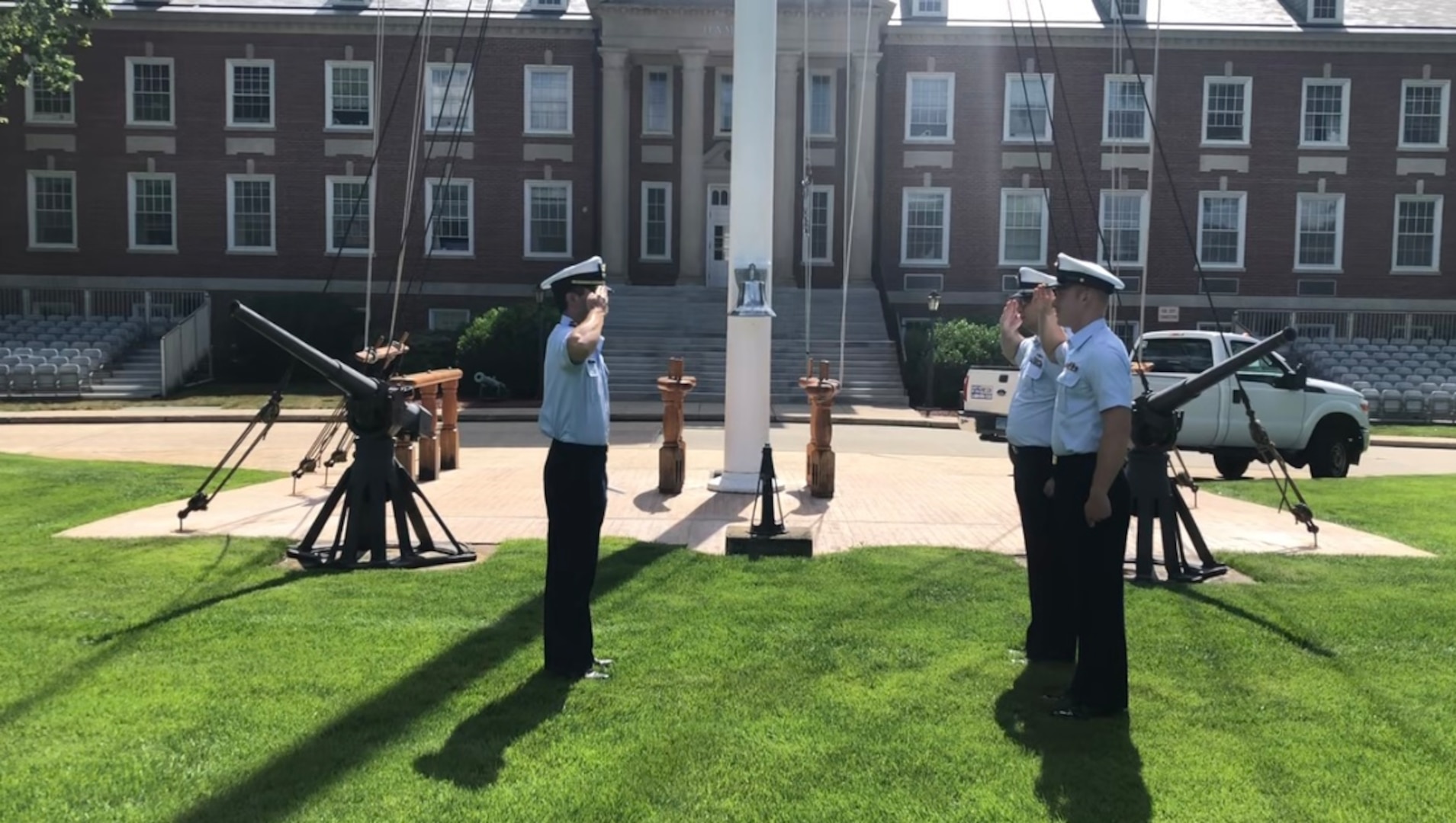 Ensign Michael Barth returns Seaman Michael O’Brien’s and Auxiliarist Alexander Rico’s salute after commissioning as an officer in the U.S. Coast Guard Reserve, July 6, 2022. (Courtesy photo by Ensign Michael Barth)