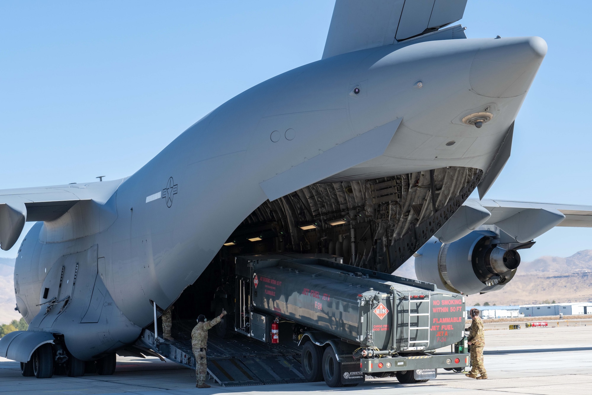 Photo of Airmen unloading truck