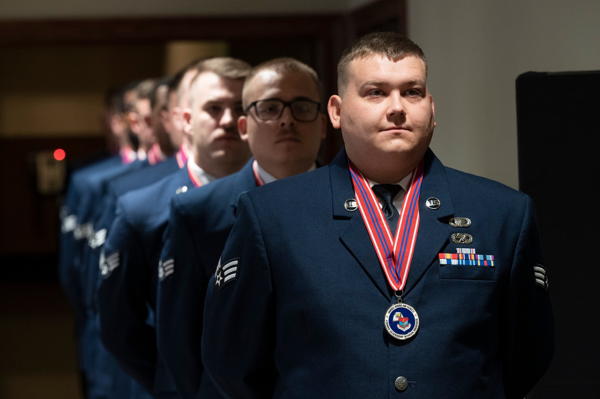 Senior Airman prepares to march class into Airman Leadership School graduation ceremony