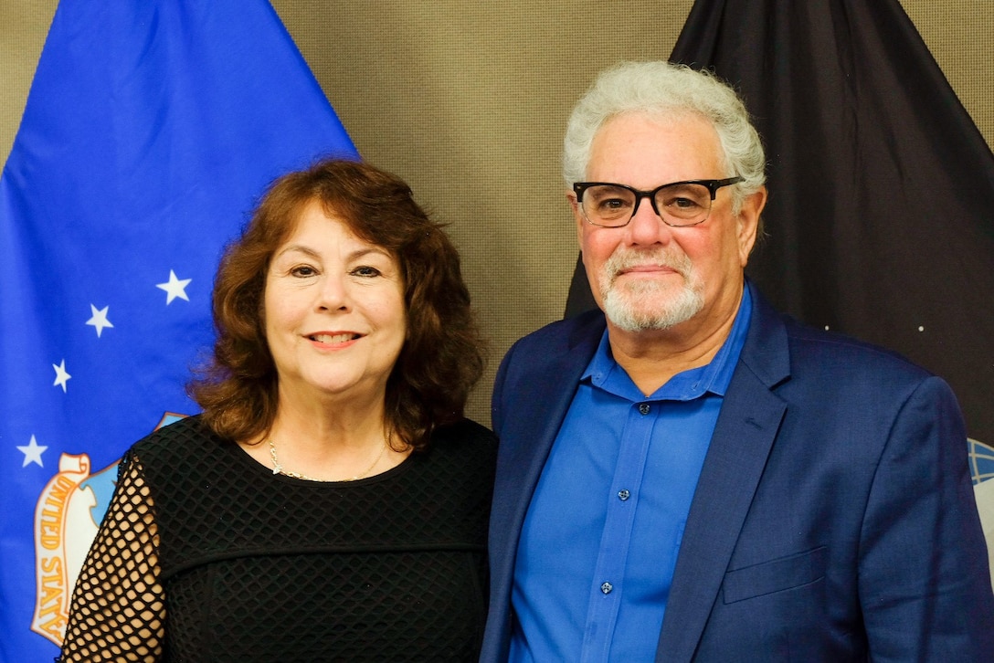 Barbara Miller, Logistics Specialist with the Subsistence supply chain, stands next to her husband Brian at her retirement ceremony Oct. 24, in Philadelphia. Miller retired from the Defense Logistics Agency Troop Support after 41 years of service.