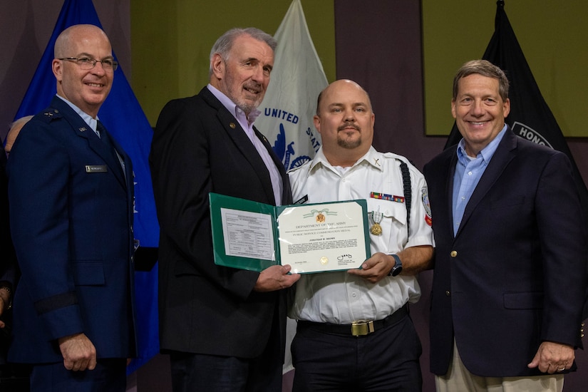 Awardee receives award.