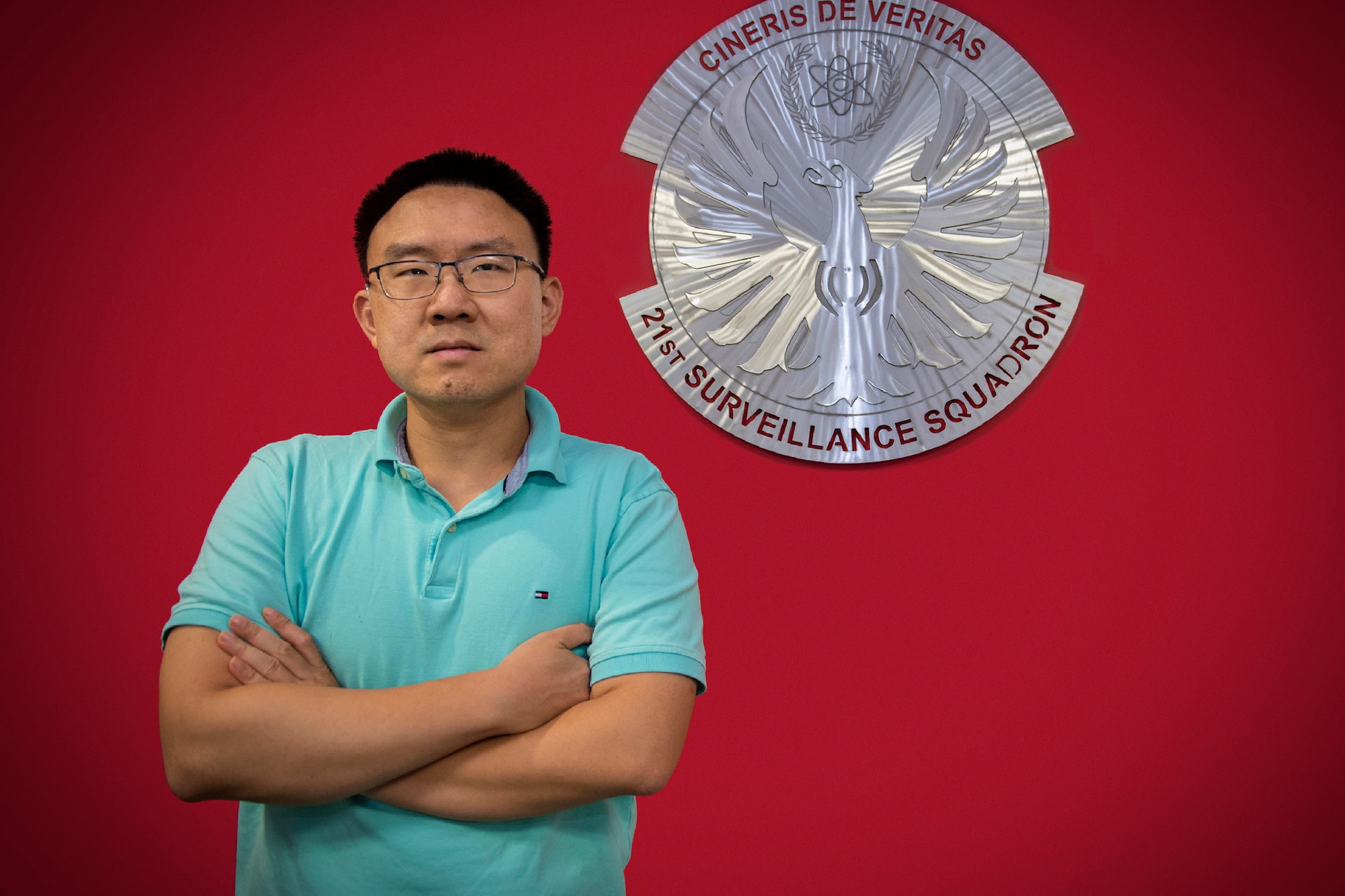 Le Chen, a statistician with the 21st Surveillance Squadron at Patrick Space Force Base, Fla., was hired in August 2022 to work at the Department of Defense’s sole nuclear treaty monitoring center.  His role is to use mathematical formulas and techniques to analyze and interpret copious amounts of technical data the Air Force Technical Applications Center receives on a daily basis.  Chen is also deaf and communicates almost exclusively using sign language.  (U.S. Air Force photo by Matthew S. Jurgens)
