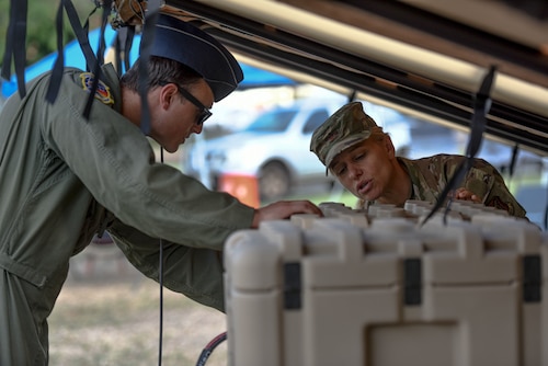 U.S. Air Force Capt. Bryan Anderson, 15th Wing Innovation Chief, shares insights about the Solar Powered Expeditionary Tent System with Col. Michele Lo Bianco, 15th Wing commander during an innovation demonstration at Joint Base Pearl Harbor-Hickam, Hawaii, Oct. 18, 2022. Anderson leads the 15th Wing innovation cell named Aloha Spark. Aloha Spark’s mission is to significantly increase military effectiveness through agile practices, technology and partnerships while honing in on the agile combat employment framework . (U.S. Air Force photo by Tech. Sgt. Anthony Nelson Jr.)