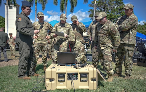 U.S. Air Force Airmen assigned to the 15th Aircraft Maintenance Squadron conduct training on a portable operations network integrator during an innovation demonstration at Joint Base Pearl Harbor-Hickam, Hawaii, Oct. 18, 2022. These Airmen are expanding their knowledge, skills and abilities to better engage in the agile combat employment framework required for multi-capable Airmen and foster ready forces to combatant commanders. (U.S. Air Force photo by Tech. Sgt. Anthony Nelson Jr.)