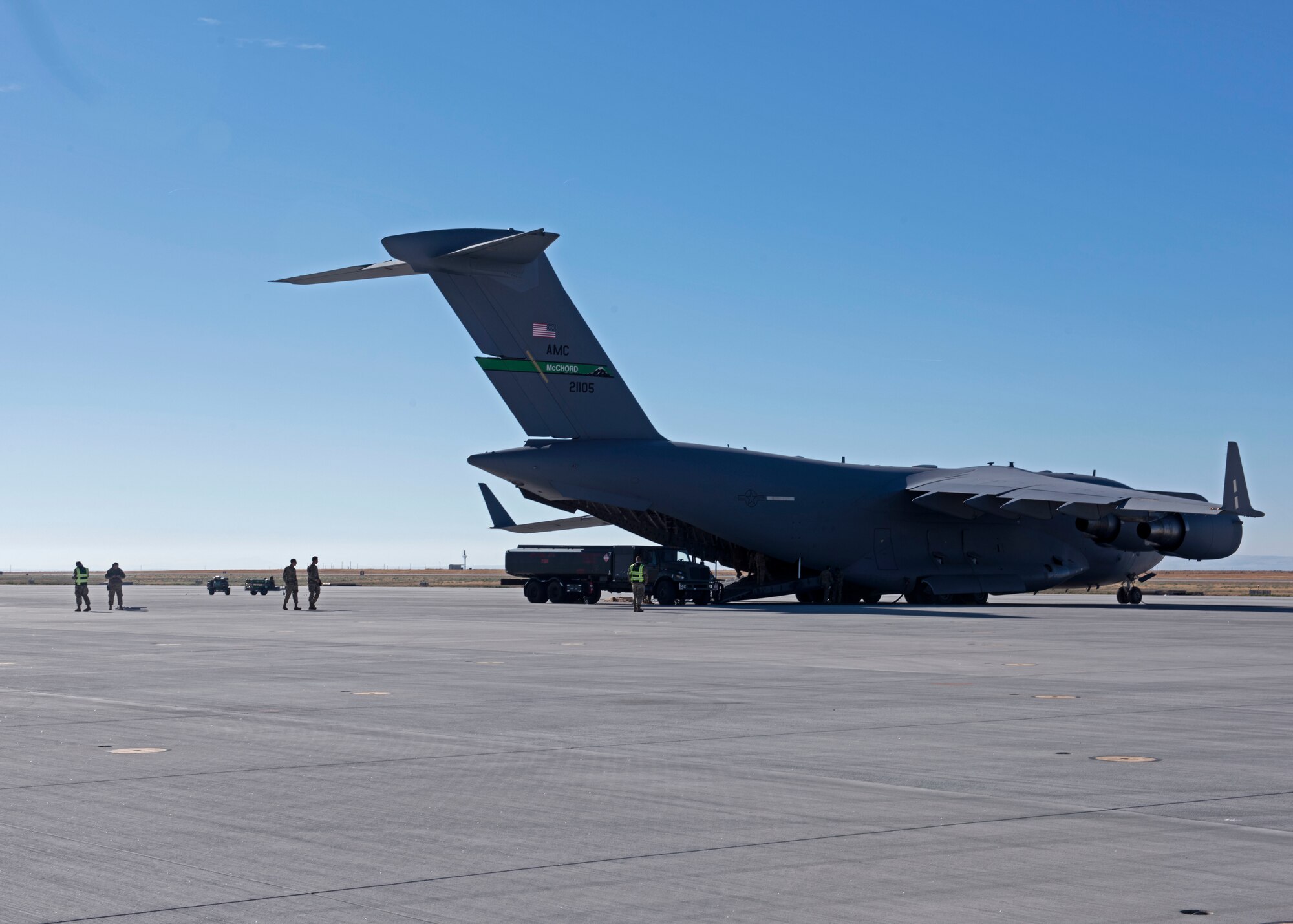 U.S. Airmen with the simulated 7th Expeditionary Airlift Squadron fuel a C-17 Globemaster III aircraft during Exercise Rainier War 22B at Mountain Home Air Force Base, Idaho, Oct. 17, 2022. Airmen from multiple Team McChord units came together to form the 7th EAS during Rainier War 22B; which is a full-scale readiness exercise simulating a deployment in support of U.S. Indo-Pacific areas of responsibility. (U.S. Air Force photo by Staff Sgt. Zoe Thacker)