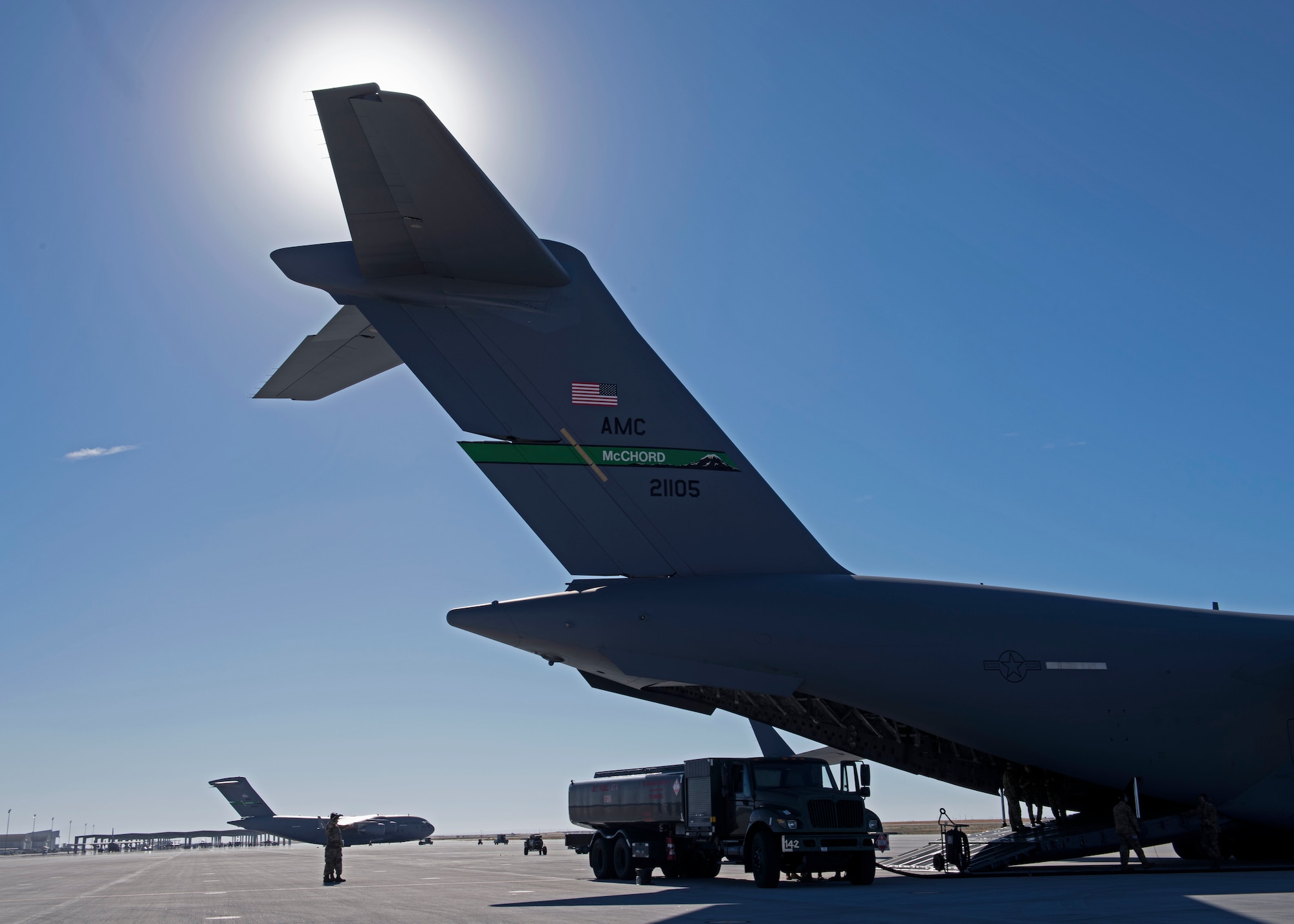 U.S. Airmen with the simulated 7th Expeditionary Airlift Squadron fuel a C-17 Globemaster III aircraft during Exercise Rainier War 22B at Mountain Home Air Force Base, Idaho, Oct. 17, 2022. Airmen from multiple Team McChord units came together to form the 7th EAS during Rainier War 22B; which is a full-scale readiness exercise simulating a deployment in support of U.S. Indo-Pacific areas of responsibility. (U.S. Air Force photo by Staff Sgt. Zoe Thacker)