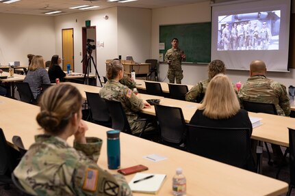 Alaska Air National Guard Senior Master Sgt. Jeremy Maddamma, a pararescueman in the 212th Rescue Squadron, speaks during a National Disability Employment Awareness Month observation luncheon on Joint Base Elmendorf-Richardson, Alaska, Oct. 19, 2022. During the month of October, the Alaska National Guard joins the Department of Defense in recognized the contributions and accomplishments of the men and woman with disabilities that strengthen the nation. (Alaska National Guard photo by Victoria Granado)