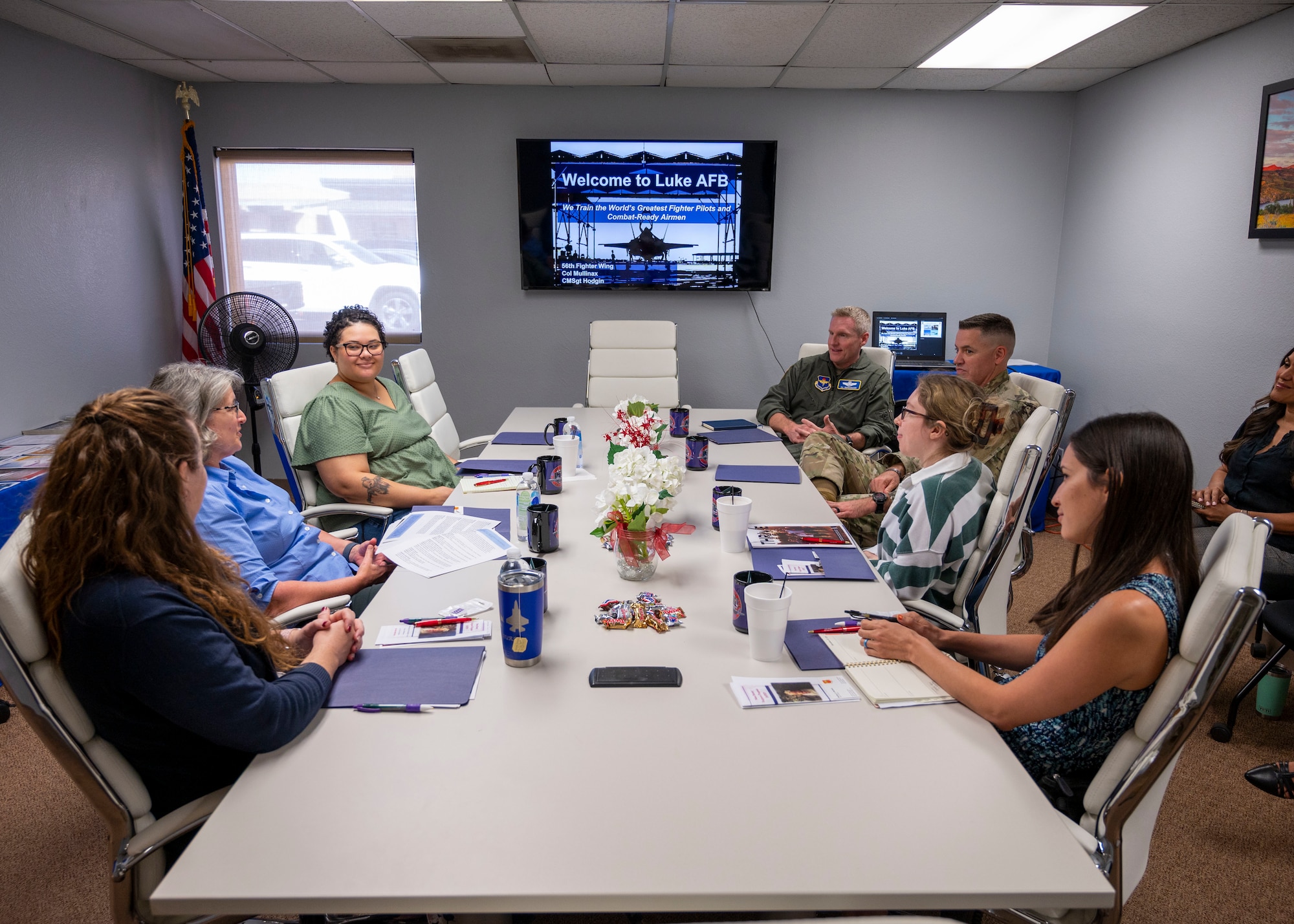U.S. Air Force Brig. Gen. Jason Rueschhoff, 56th Fighter Wing commander, and Chief Master Sgt. Jason Shaffer, 56th FW command chief, listen to the latest class of military spouses during the Heart Link Spouse Orientation, Oct. 19, 2022, at Luke Air Force Base, Arizona.