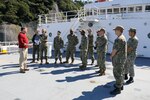 YOKOSUKA, Japan (Oct 20, 2022) Captain Scott Spears speaks with Sailors assigned to Commander, Submarine Group 7 (CSG-7) during a tour of the Pathfinder-class oceanographic survey ship USNS Mary Sears (T-AGS 65), Oct. 20, 2022. U.S. Naval Meteorology and Oceanography Command directs and oversees more that 2,500 globally-distributed military and civilian personnel who collect, process and exploit environmental information to assist Fleet and Joint Commanders in all warfare area to make better decisions, based on assured environmental information, faster than the adversary. CSG-7 directs forward-deployed, combat capable forces across the full spectrum of undersea warfare throughout the Western Pacific, Indian Ocean and Arabian Sea. (U.S. Navy photo by Mass Communication Specialist 2nd Class Travis Baley)