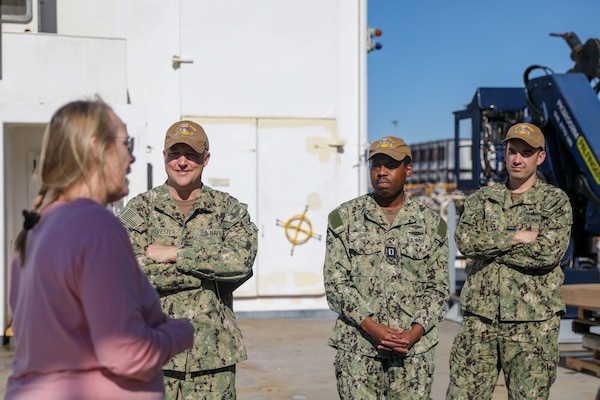 YOKOSUKA, Japan (Oct 20, 2022) Margaret Pike, senior NAVOCEANO representative, speaks with Sailors assigned to Commander, Submarine Group 7 (CSG-7) during a tour of the Pathfinder-class oceanographic survey ship USNS Mary Sears (T-AGS 65), Oct. 20, 2022. U.S. Naval Meteorology and Oceanography Command directs and oversees more that 2,500 globally-distributed military and civilian personnel who collect, process and exploit environmental information to assist Fleet and Joint Commanders in all warfare area to make better decisions, based on assured environmental information, faster than the adversary. CSG-7 directs forward-deployed, combat capable forces across the full spectrum of undersea warfare throughout the Western Pacific, Indian Ocean and Arabian Sea. (U.S. Navy photo by Mass Communication Specialist 2nd Class Travis Baley)