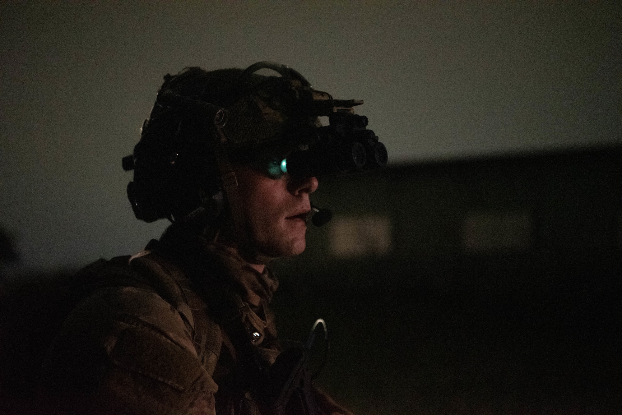 An Airman wears night vision goggles.