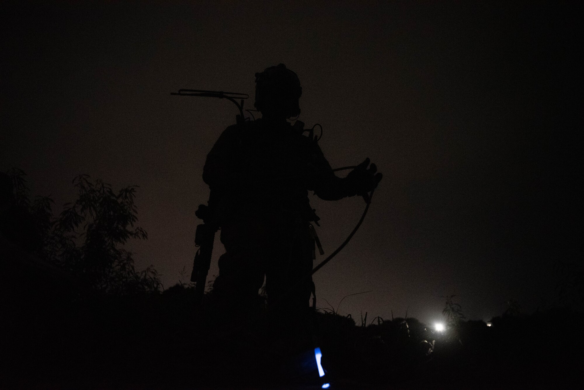An Airman holds a rope.