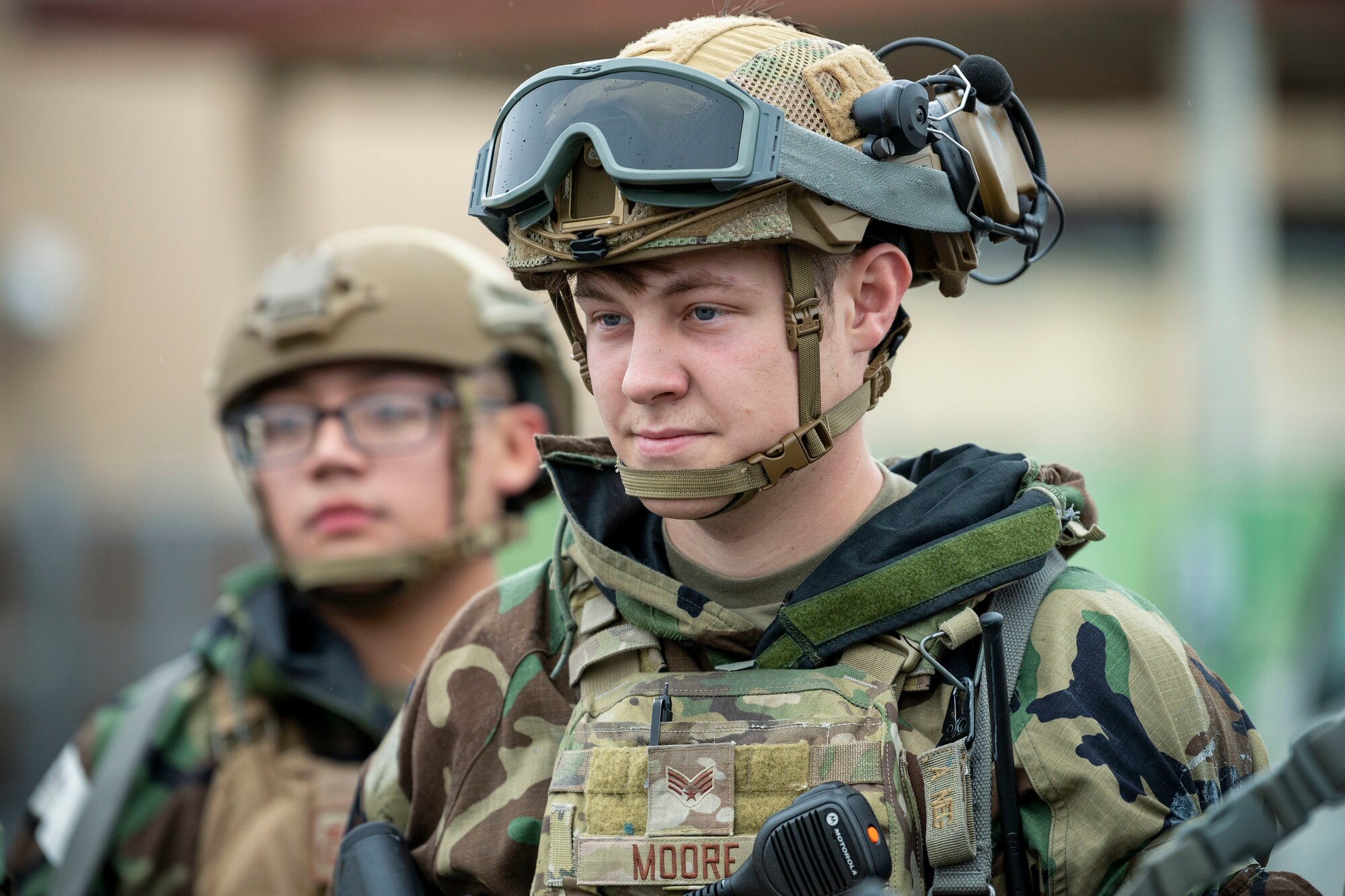 two armored up airmen stand in formation