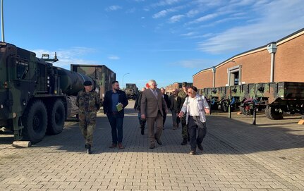 Ron Diehl, the Dülmen Army Prepositioned Stocks-2 worksite maintenance manager, briefs German State Military Command North Rhine-Westphalia Commanding General Brig. Gen. Dieter Meyerhoff and U.S. Consulate General Düsseldorf Political and Economic Consul Chapman Godbey on tire maintenance and protection. Meyerhoff, Godbey and other officials visited the Dülmen APS-2 worksite Oct. 26 to gain a better understanding of operations there. (U.S. Army courtesy photo)