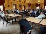 people in a cafeteria having a discussion