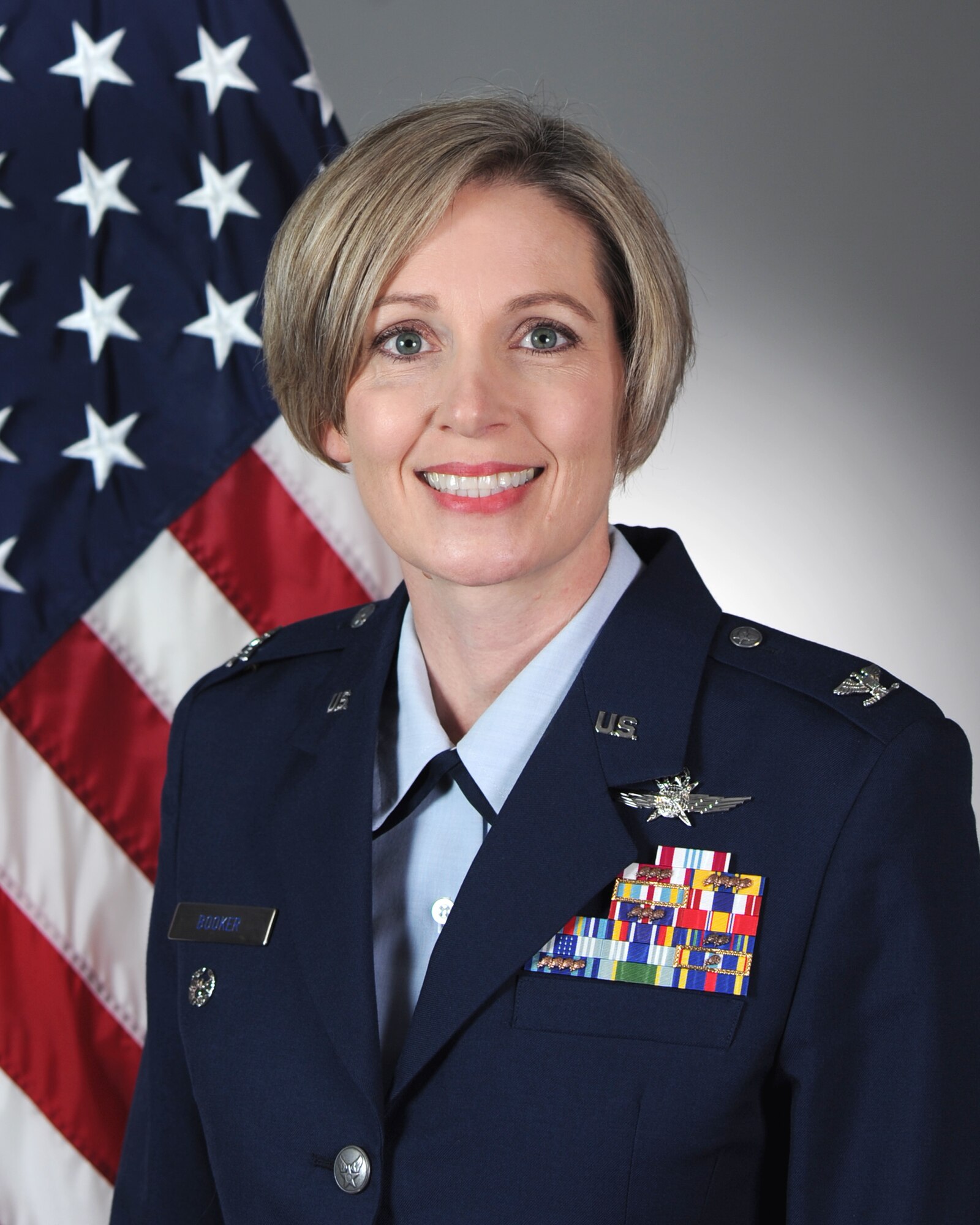 Colonel in blue uniform.