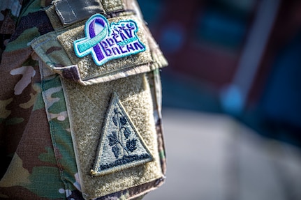 A Connecticut National Guard Soldier wears a "breaking the stigma" patch on his uniform at the Army Aviation Support Facility in Windsor Locks, Conn., Sept. 8, 2022. The patch was a project of the state's Resilience, Risk Reduction and Suicide Program to raise awareness about the stigma of seeking help for mental health in the military.