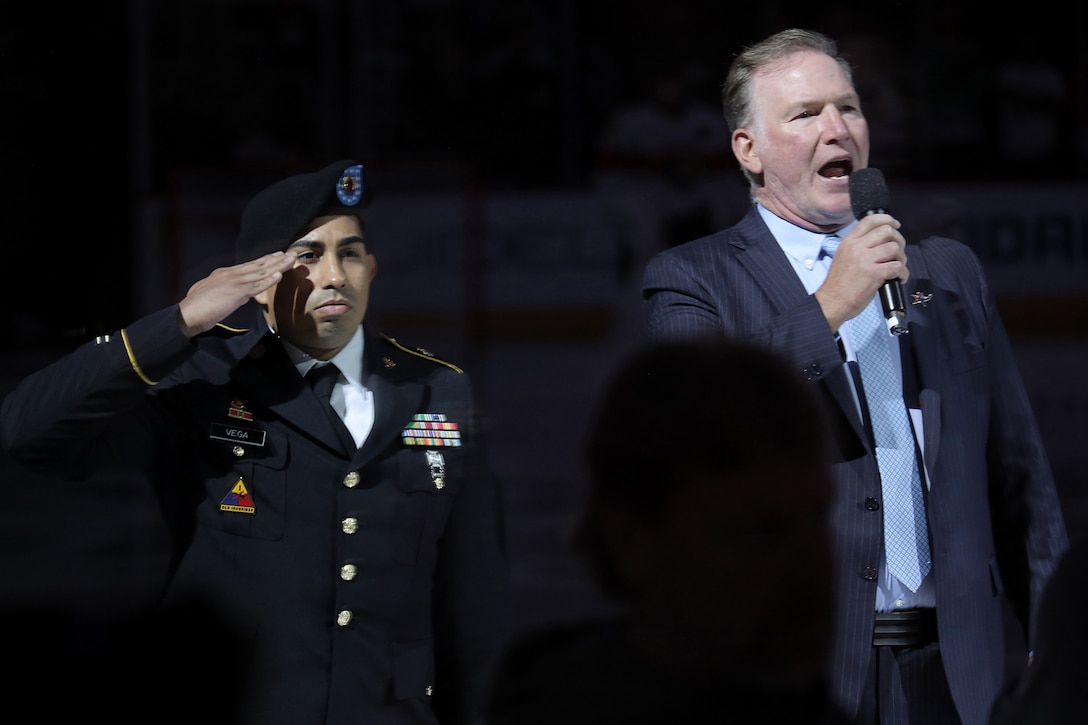 U.S. Army Reserve Staff Sgt. Alberto Vega, Information Technology Specialist, 85th U.S. Army Reserve Support Command, renders a salute during the playing of the National Anthem at the Chicago Blackhawks home game versus the Florida Panthers, October 25, 2022.