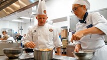 U.S. Marine Corps Gunnery Sgt. Michael D. Watts, mess chief, with 2nd Battalion 2nd Marine Division, and Kayla Shaffer, a student at Johnson and Wales University, compete in a cooking competition during Marine Week in Charlotte, N.C., Sept. 7, 2018. Marines, local chefs and students from Johnson and Wales University participate in a culinary competition using items from meals ready to eat during Marine Week Charlotte. Marine Week Charlotte is an opportunity for the people of the greater Charlotte area to meet Marines and learn about the Marine Corps’ history, traditions and value to the nation.