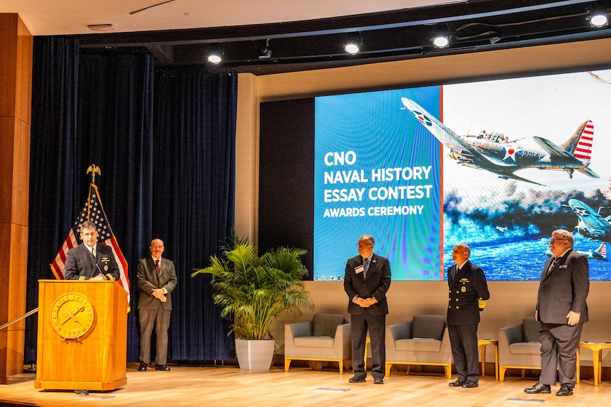 ANNAPOLIS, Maryland (Oct. 25, 2022) -- Cmdr. Matt Wright gives remarks as the first place winner of the Rising Historian category at the 2022 Chief of Naval Operations (CNO) Naval History Essay Contest at the United States Naval Academy, Oct. 25. Started in 2017 by then CNO Adm. John Richardson, the goal of the contest is to inspire insight and dialogue from across the widest spectrum of academic, operational, military, and civilian personnel, both from within the naval services and from those with a sincere interest in the history of the Navy, Marine Corps, and Coast Guard. (U.S. Navy photo by Mass Communication Specialist 1st Class Michael B Zingaro/released)