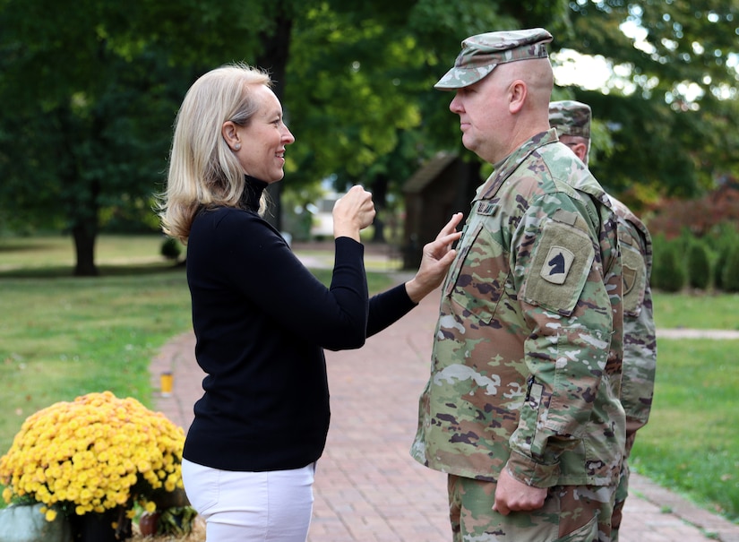 Molly Mattingly conducts the traditional ceremonially pining to her husband, Army Lt. Col. Steve Mattingly, in a ceremony at the Federal Hill Mansion at My Old Kentucky Home State Park in Bardstown Ky. on Oct 6, 2022. (U.S. Army National Guard photo by Lt. Col. Carla Raisler)