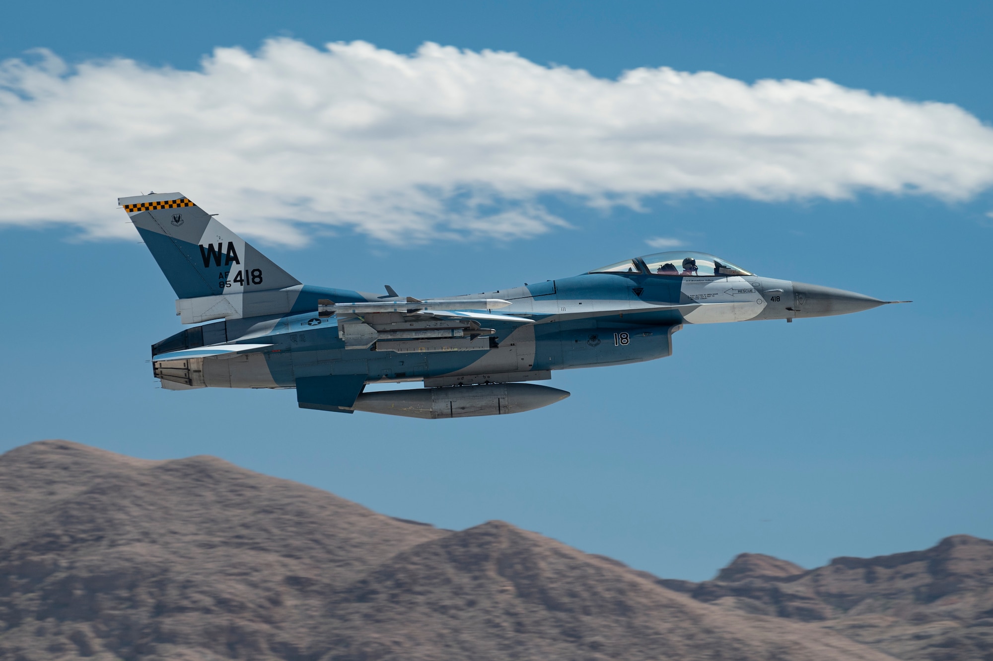 An F-16 Fighting Falcon assigned to the 64th Aggressor Squadron, Nellis Air Force Base, Nevada, takes off in support of Black Flag 22-2, at Nellis Air Force Base, Sept. 20 Sept. 2022. The 64th AGRS provided adversary air during the exercise. This Black Flag assessed interoperability of near-future capabilities across the domains and services with a focus on tactical data link and consolidated F-35 cross service maintenance and logistics. (U.S. Air Force photo by William R. Lewis)