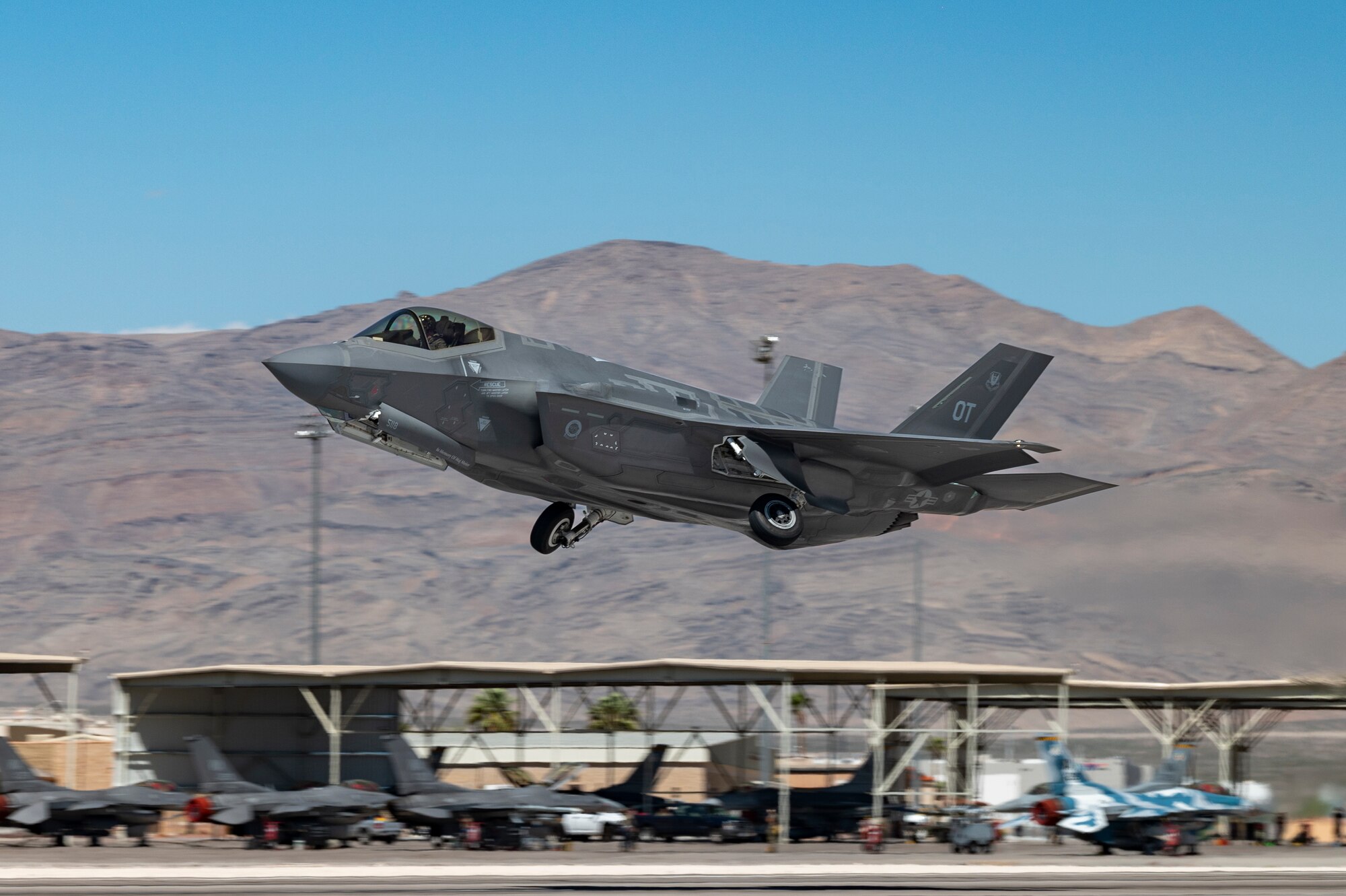 An F-35A Lightning II, assigned to the 422nd Test and Evaluation Squadron (TES), Nellis Air Force Base (AFB), Nevada, takes off for a Black Flag 22-2 mission at Nellis AFB, Nev., Sept. 20, 2022. This Black Flag assessed interoperability of near-future capabilities across the domains and services with a focus on tactical data link and consolidated F-35 cross service maintenance and logistics. (U.S. Air Force photo by William R. Lewis)