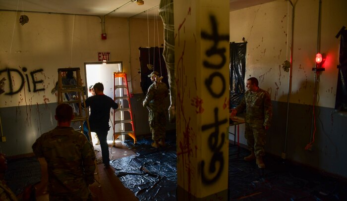 Beale volunteer Airman work together to set up the haunted house at Beale Air Force Base