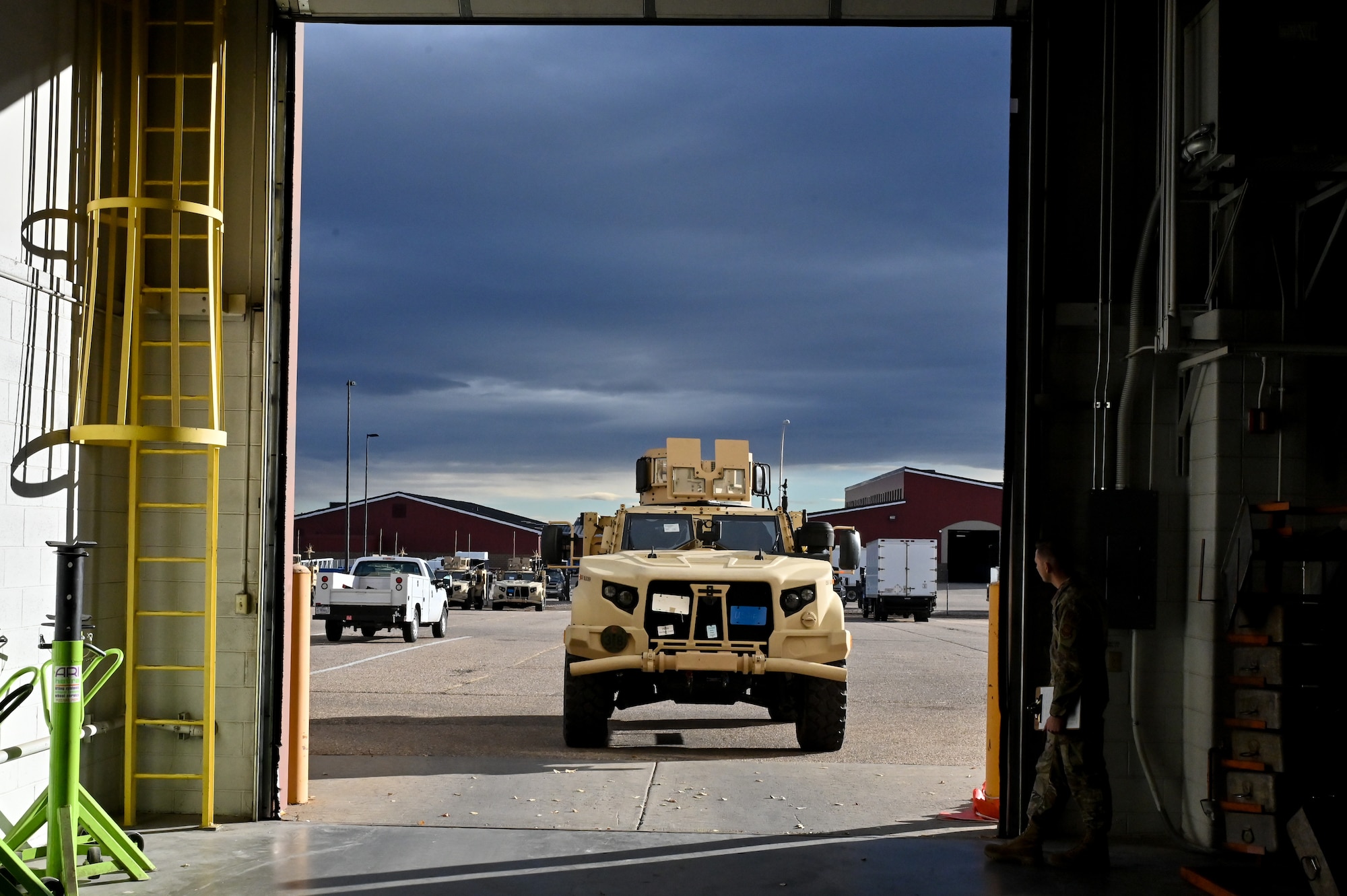 Mark Bramman, 90th Logistics Readiness Squadron vehicle maintenance craftsman, drives a Joint Light Tactical Vehicle into the maintenance bay before performing a limited technical inspection on F.E. Warren Air Force Base, Wyoming, Oct 25, 2022. The 90 LRS is tasked with preparing the next generation of security forces vehicles sent to protect the 90th Missile Wing’s ICBM system as part of Air Force Global Strike Command’s priority to modernize. (U.S. Air Force photo by Joseph Coslett)