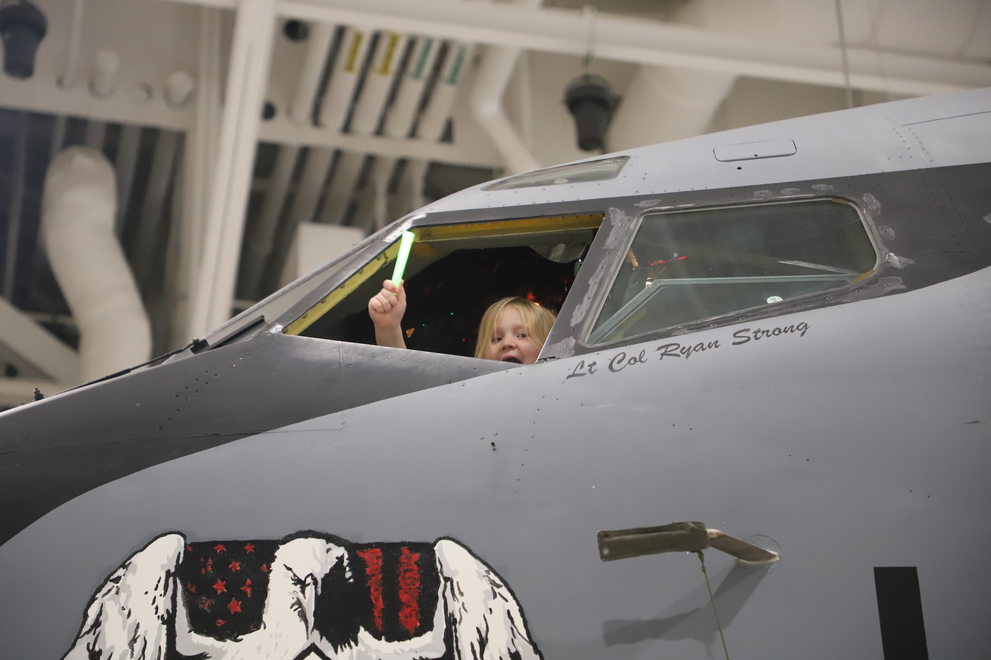 Tinley Benyshek, Pilot for the Day, waves out of the pilot window on a KC-135 at the 190th Air Refueling Wing in Topeka, KS, October 24, 2022. Tinley is the first Pilot for a Day participant at the 190th ARW.