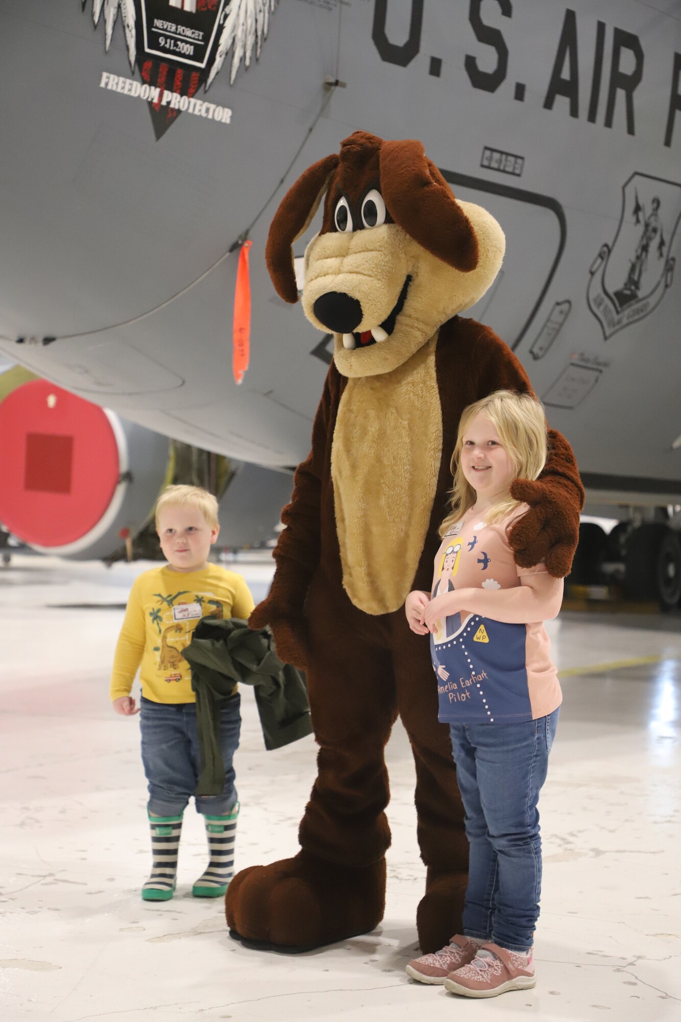 Tinley Benyshek, Pilot for the Day, and her brother, Trip, pose with Wylie at the 190th Air Refueling Wing in Topeka, KS, October 24, 2022. Tinley is the first Pilot for a Day participant at the 190th ARW.