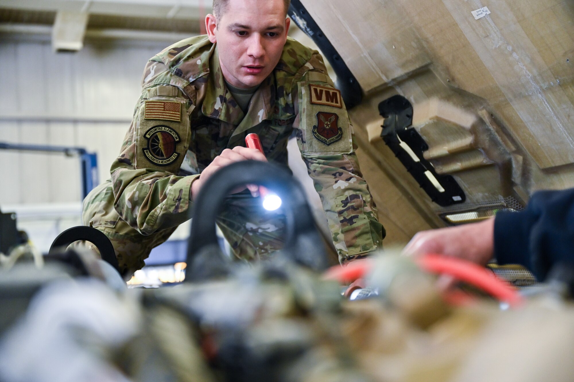 Senior Airman Korey Sarantopoulos, 90th Logistics Readiness Squadron vehicle maintenance journeyman, checks the electrical, brake, fuel, cooling and other systems for serviceability as part of a Joint Light Tactical Vehicle limited technical inspection at F.E. Warren Air Force Base, Wyoming, Oct 25, 2022. The 90 LRS is tasked with preparing the next generation of security forces vehicles sent to protect the 90th Missile Wing's ICBM system as part of Air Force Global Strike Command’s priority to modernize. (U.S. Air Force photo by Joseph Coslett)