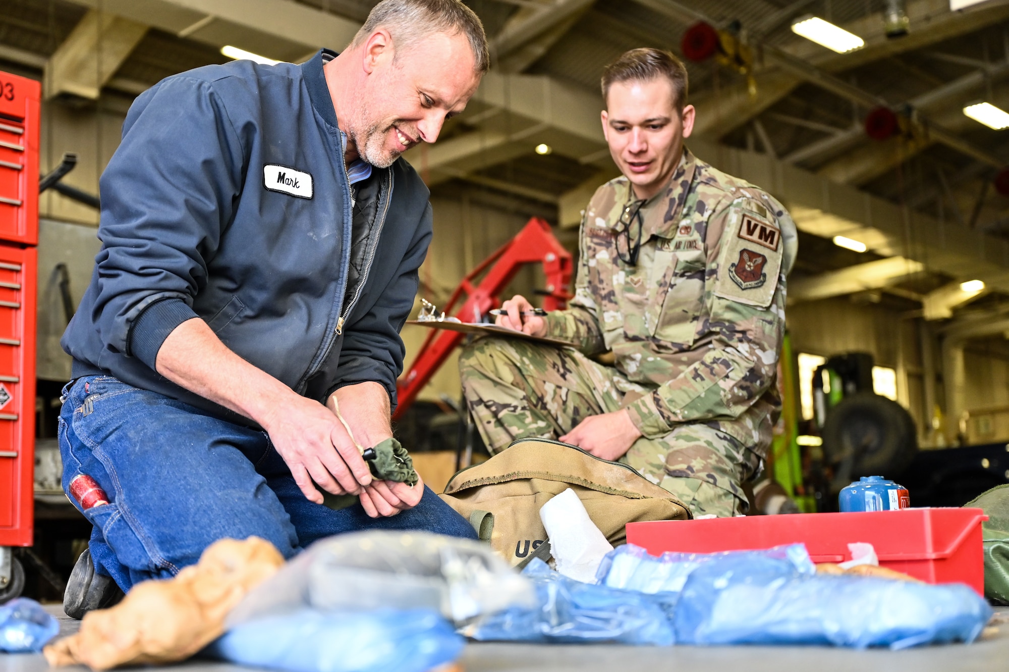 Mark Bramman, 90th Logistics Readiness Squadron vehicle maintenance craftsman, and Senior Airman Korey Sarantopoulos, 90 LRS vehicle maintenance journeyman, conduct a tool inventory as part of a Joint Light Tactical Vehicle limited technical inspection at F.E. Warren Air Force Base, Wyoming, Oct 25, 2022. The 90 LRS is tasked with preparing the next generation of security forces vehicles sent to protect the 90th Missile Wing's ICBM system as part of Air Force Global Strike Command’s priority to modernize. (U.S. Air Force photo by Joseph Coslett)