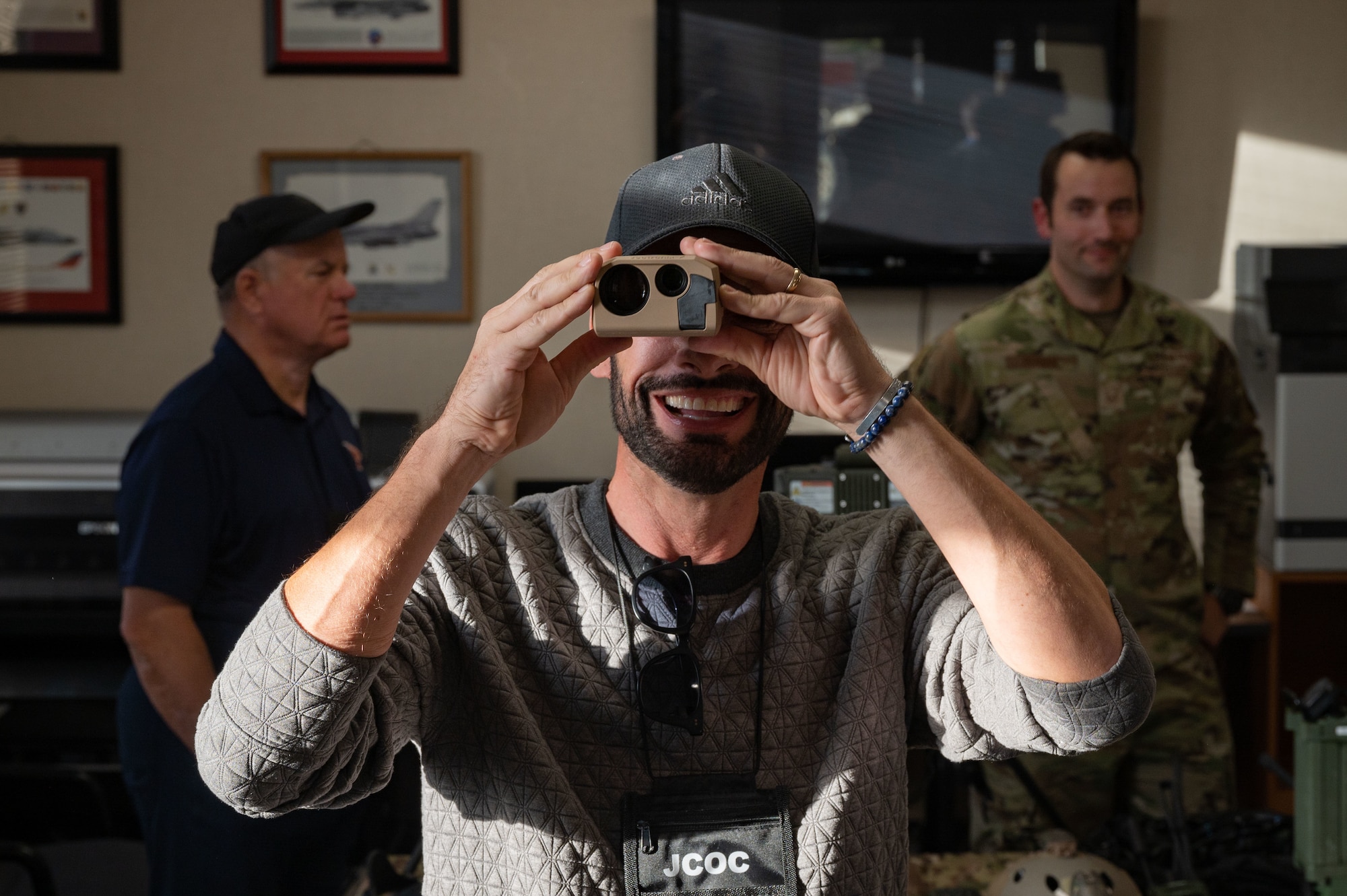 Man using a pocket laser range finder