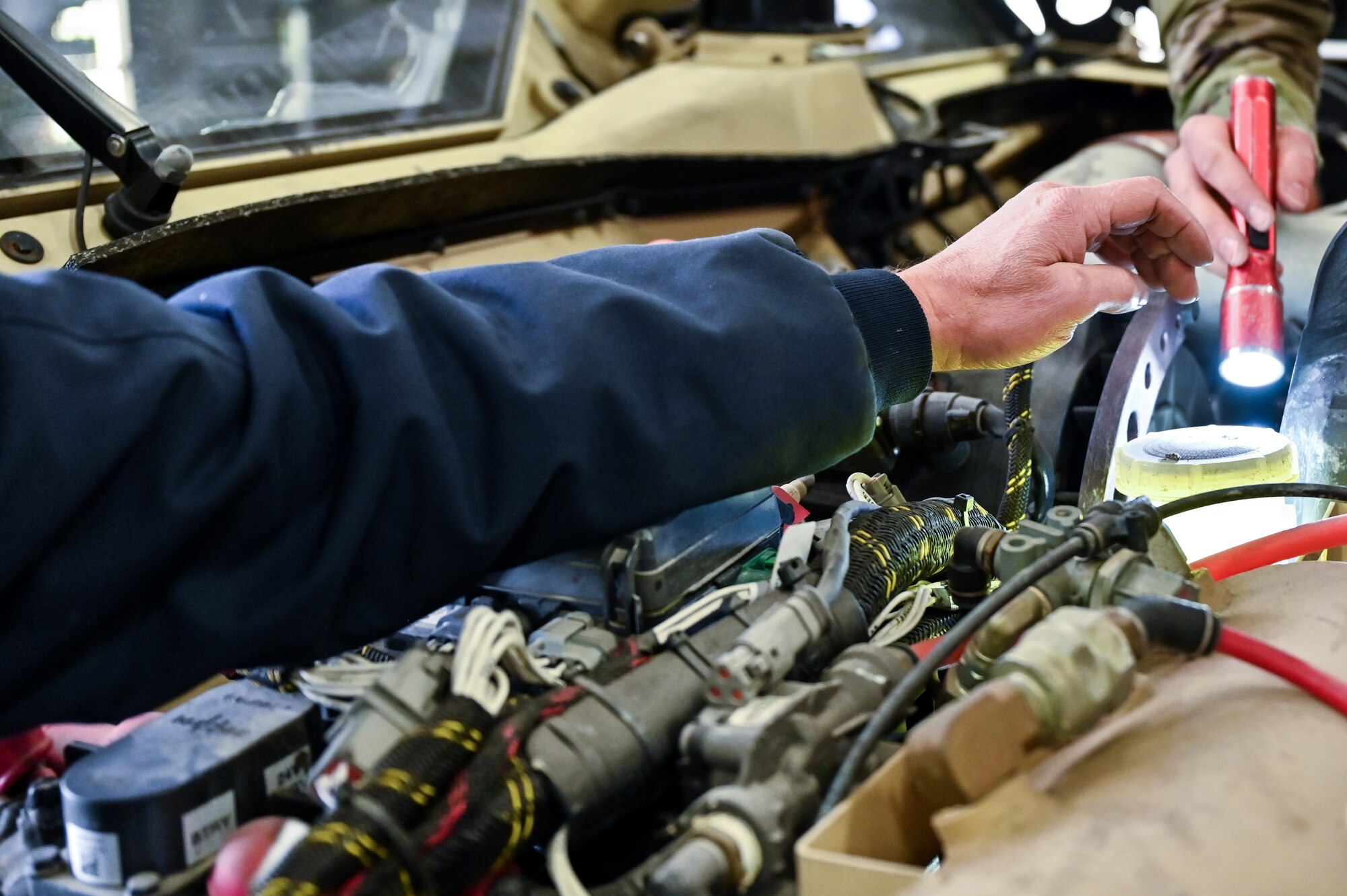 Mark Bramman, 90th Logistics Readiness Squadron vehicle maintenance craftsman, checks the electrical, brake, fuel, cooling and other systems for serviceability as part of a Joint Light Tactical Vehicle limited technical inspection at F.E. Warren Air Force Base, Wyoming, Oct 25, 2022. The 90 LRS is tasked with preparing the next generation of security forces vehicles sent to protect the 90th Missile Wing's ICBM system as part of Air Force Global Strike Command’s priority to modernize. (U.S. Air Force photo by Joseph Coslett)