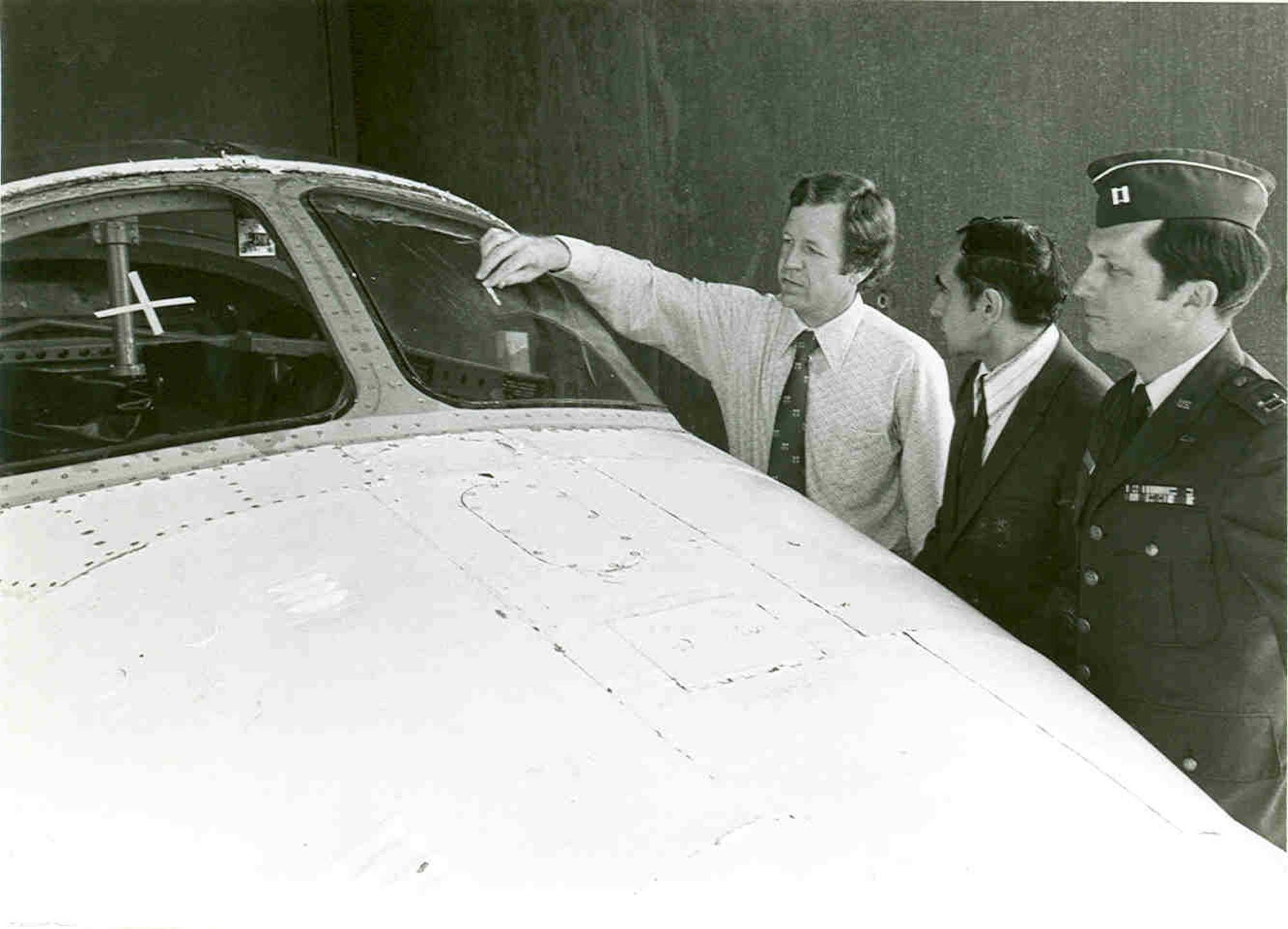 Then-project manager Gene Sanders, Richard Peterson and Capt. D.C. Chapin, from left, look at the windshield of a Cessna T-37 Tweet undergoing bird strike testing at Arnold Air Force Base, Tennessee, in 1973. These tests occurred at the Bird Impact Range. This facility, more famously known as the “Chicken Gun,” was used to simulate in-flight bird strikes to aircraft canopies and other materials by launching chicken carcasses at test articles. The first shot from the Chicken Gun was fired 50 years ago. (U.S. Air Force photo)