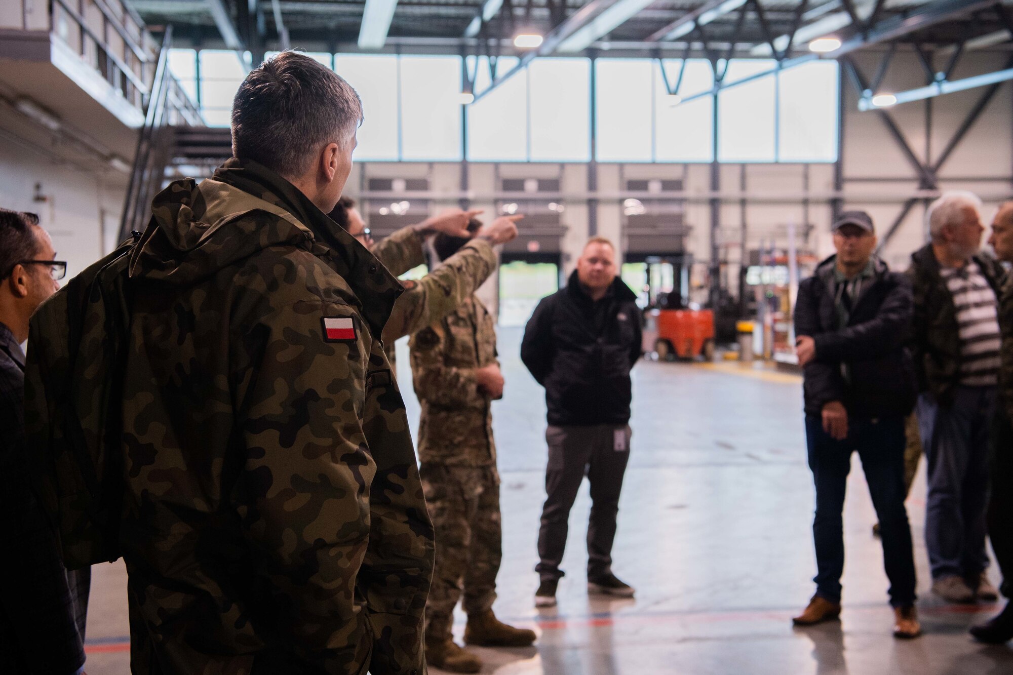 Polish service members tour the 721st Aerial Port Squadron at Ramstein Air Base, Germany, Oct. 26, 2022.