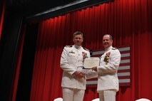 Capt. Tim DeWitt, Naval Facilities Engineering Systems Command Fast East, is relieved by Capt. Lance Flood during a change of command and retirement ceremony for DeWitt on board Fleet Activities Yokosuka, Japan, Oct. 28.