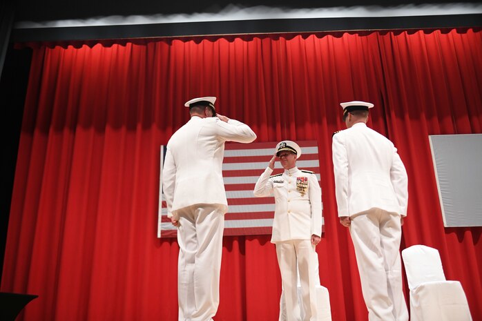 Capt. Tim DeWitt, Naval Facilities Engineering Systems Command Fast East, is relieved by Capt. Lance Flood during a change of command and retirement ceremony for DeWitt on board Fleet Activities Yokosuka, Japan, Oct. 28.