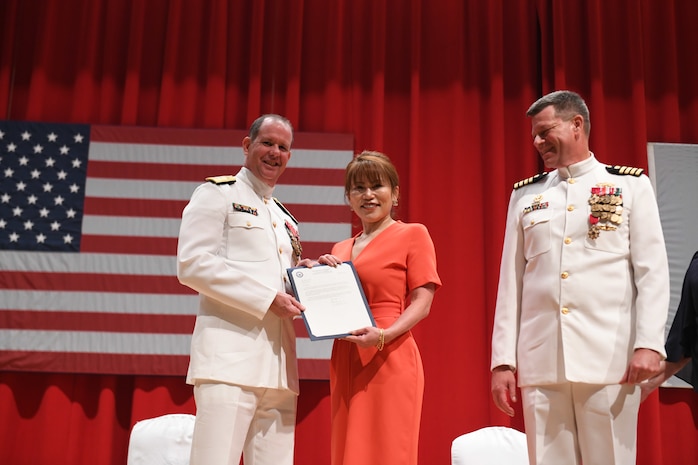 Capt. Tim DeWitt, Naval Facilities Engineering Systems Command Fast East, is relieved by Capt. Lance Flood during a change of command and retirement ceremony for DeWitt on board Fleet Activities Yokosuka, Japan, Oct. 28.