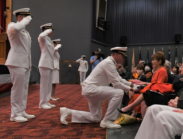 Capt. Tim DeWitt, Naval Facilities Engineering Systems Command Fast East, is relieved by Capt. Lance Flood during a change of command and retirement ceremony for DeWitt on board Fleet Activities Yokosuka, Japan, Oct. 28.