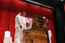 Capt. Tim DeWitt, Naval Facilities Engineering Systems Command Fast East, is relieved by Capt. Lance Flood during a change of command and retirement ceremony for DeWitt on board Fleet Activities Yokosuka, Japan, Oct. 28.