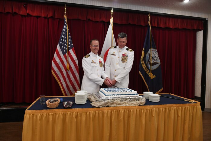 Capt. Tim DeWitt, Naval Facilities Engineering Systems Command Fast East, is relieved by Capt. Lance Flood during a change of command and retirement ceremony for DeWitt on board Fleet Activities Yokosuka, Japan, Oct. 28.