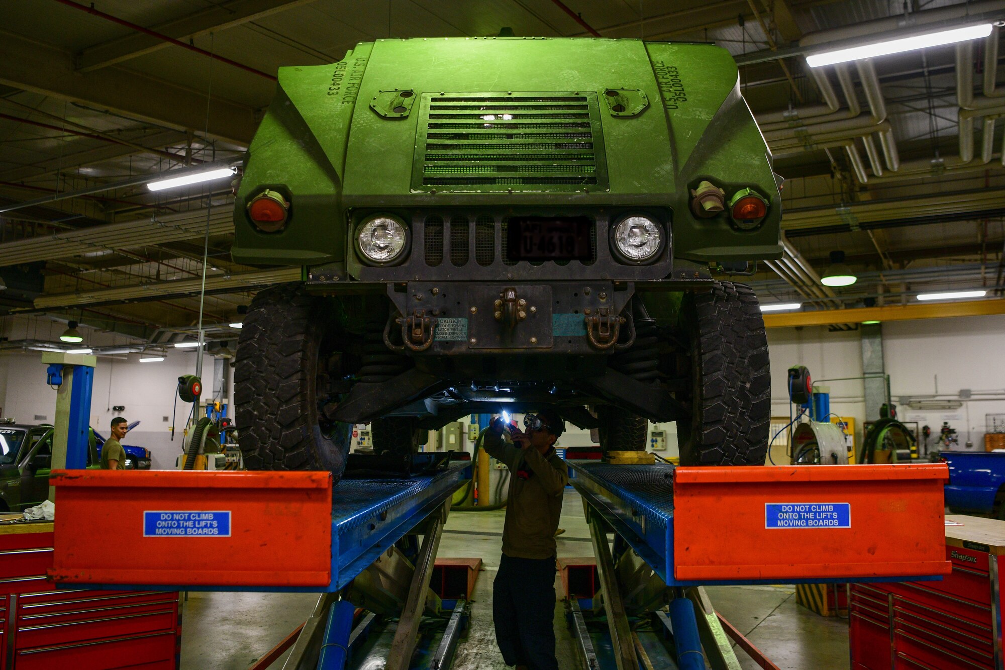 Airman 1st Class Luis Lucatero, 31st Logistics Readiness Squadron vehicle maintenance apprentice, inspects the underside of a Humvee at Aviano Air Base, Italy, Oct. 20, 2022. The types of vehicles the 31st LRS Vehicle Maintenance team manages includes sedans, vans, trucks, bobtails, forklifts, Humvees, security forces patrol vehicles, 31st Civil Engineer Squadron heavy duty vehicles, busses, firetrucks, refueling trucks and more. (U.S. Air Force photo by Senior Airman Brooke Moeder)