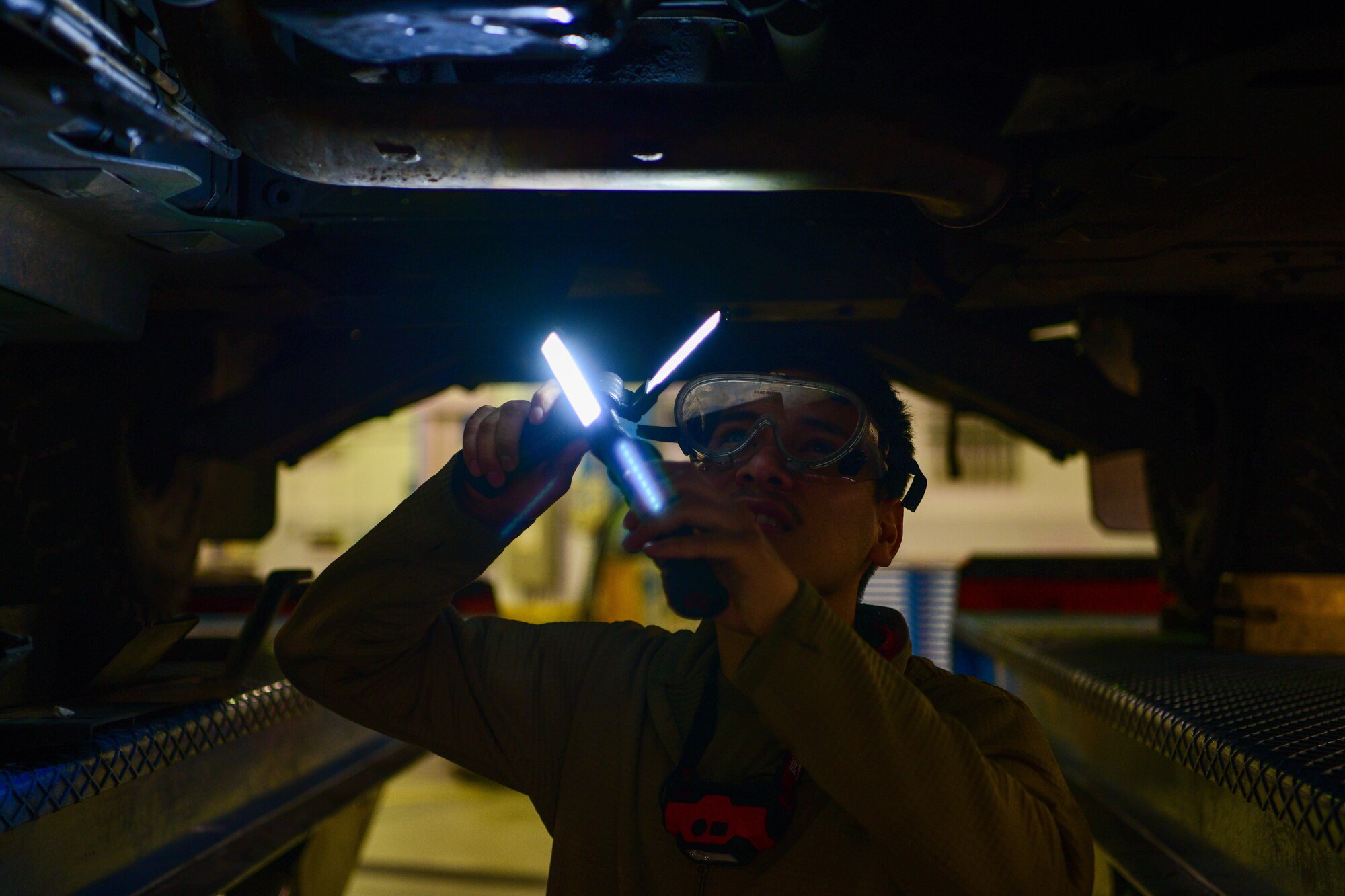 Airman 1st Class Luis Lucatero, 31st Logistics Readiness Squadron vehicle maintenance apprentice, inspects the underside of a Humvee at Aviano Air Base, Italy, Oct. 20, 2022. Light duty maintenance works on all of the regular trucks, including vehicles that haven’t been modified as well as vehicles that are good to drive on the road as an everyday vehicle such as Humvees. (U.S. Air Force photo by Senior Airman Brooke Moeder)